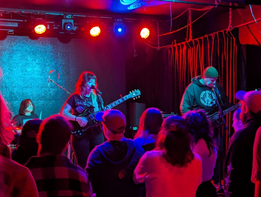 An image of the band Tiny Stills playing live.